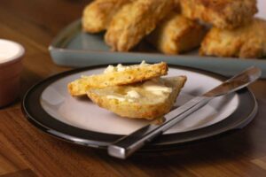 Cheese scones with a generous spread of butter.