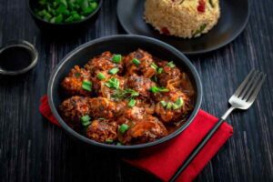 A plate of savory Chicken Manchurian, a delightful fusion dish.