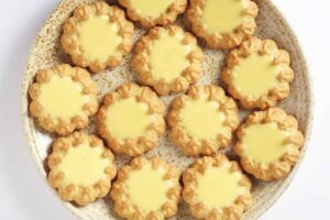 A close-up of Crown Biscuits, showcasing their intricate crown-shaped design.